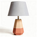 Table lamp with geometric ceramic base in orange pink and beige 30 x 30 x 55cm